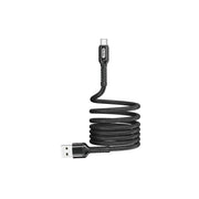Black USB cable coiled on a white background