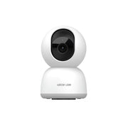 White security camera with black lens on a white background